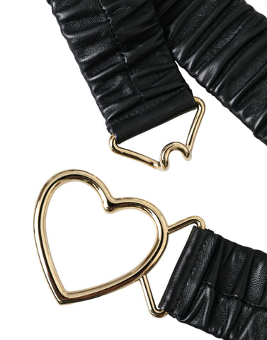 Black leather belt with gold heart-shaped metal buckle by Dolce & Gabbana, featuring a sleek and stylish design.