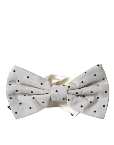Gray and black polka dot polyester bow tie for men by Jag Couture London New York, shown on a white background.
