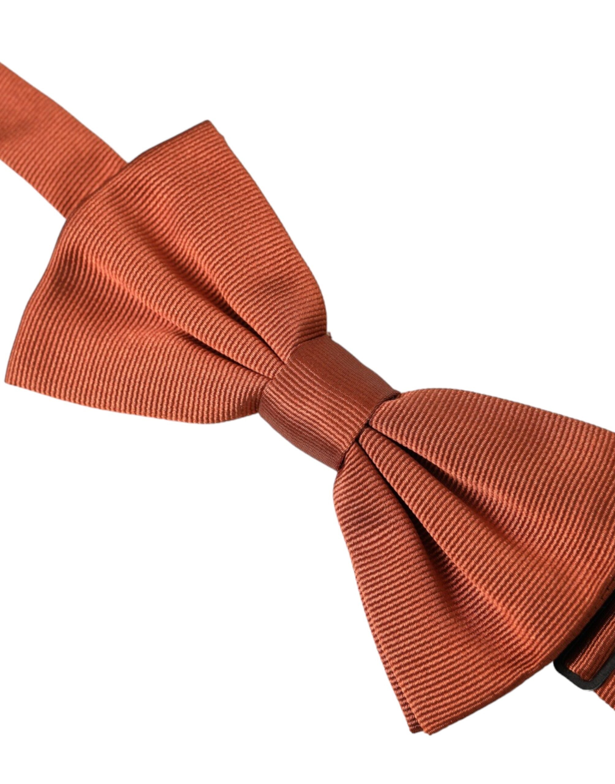 Brown silk adjustable men's bow tie from Dolce & Gabbana, featuring a classic style and elegant design.