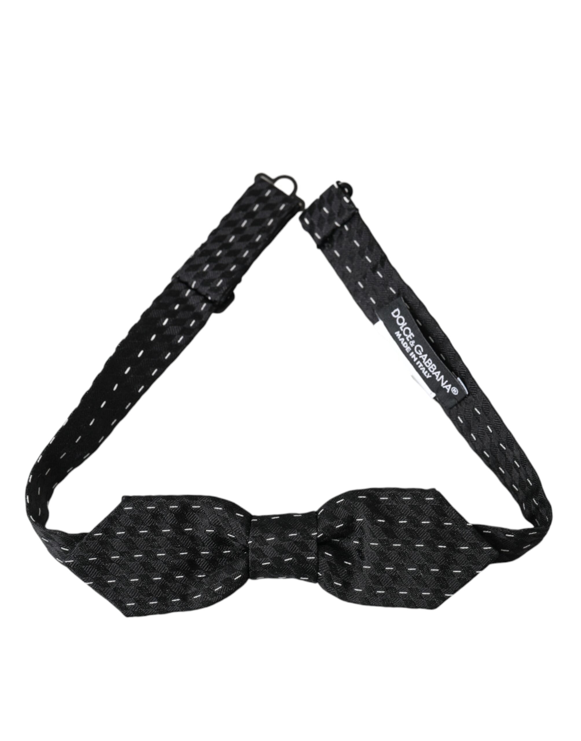 Black and white stitched silk men's neck bow tie by Dolce & Gabbana shown on a white background.