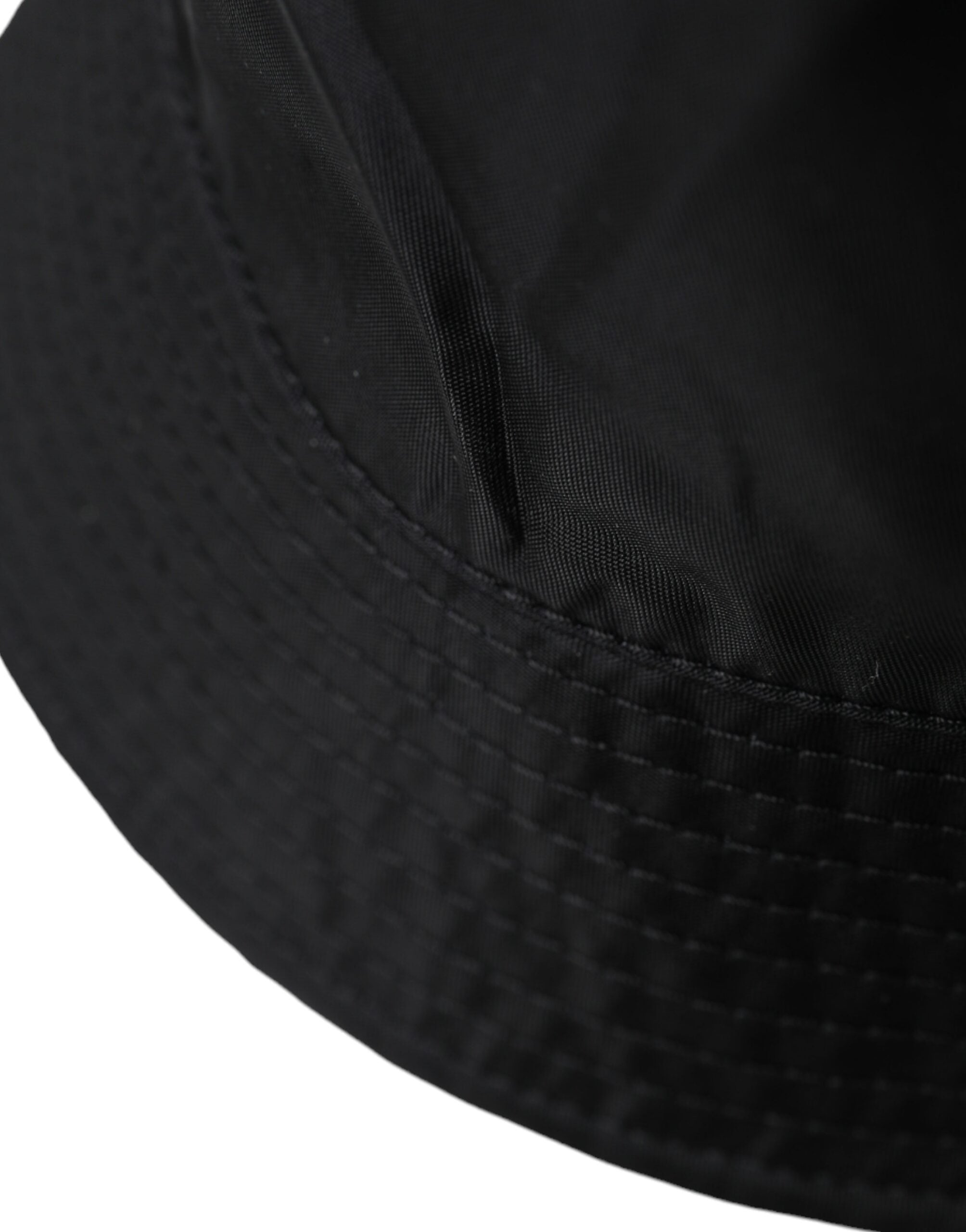 Black wide brim bucket hat for men by Dolce & Gabbana, featuring a stylish, spacious brim and classic design.