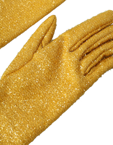 Gold Lurex Fantasia mid-arm length gloves by Dolce & Gabbana featuring shimmering metallic fabric and elegant design.