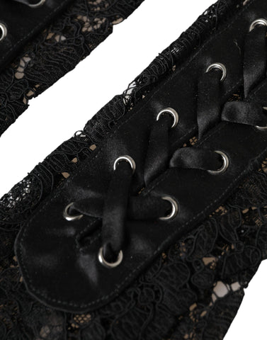 Black Taormina lace elbow length gloves by Dolce & Gabbana, featuring intricate lace detailing and a elegant fit.