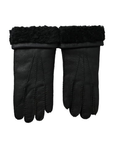 Black leather gloves with fur trim, short style, from Dolce & Gabbana, shown on a model's hands.