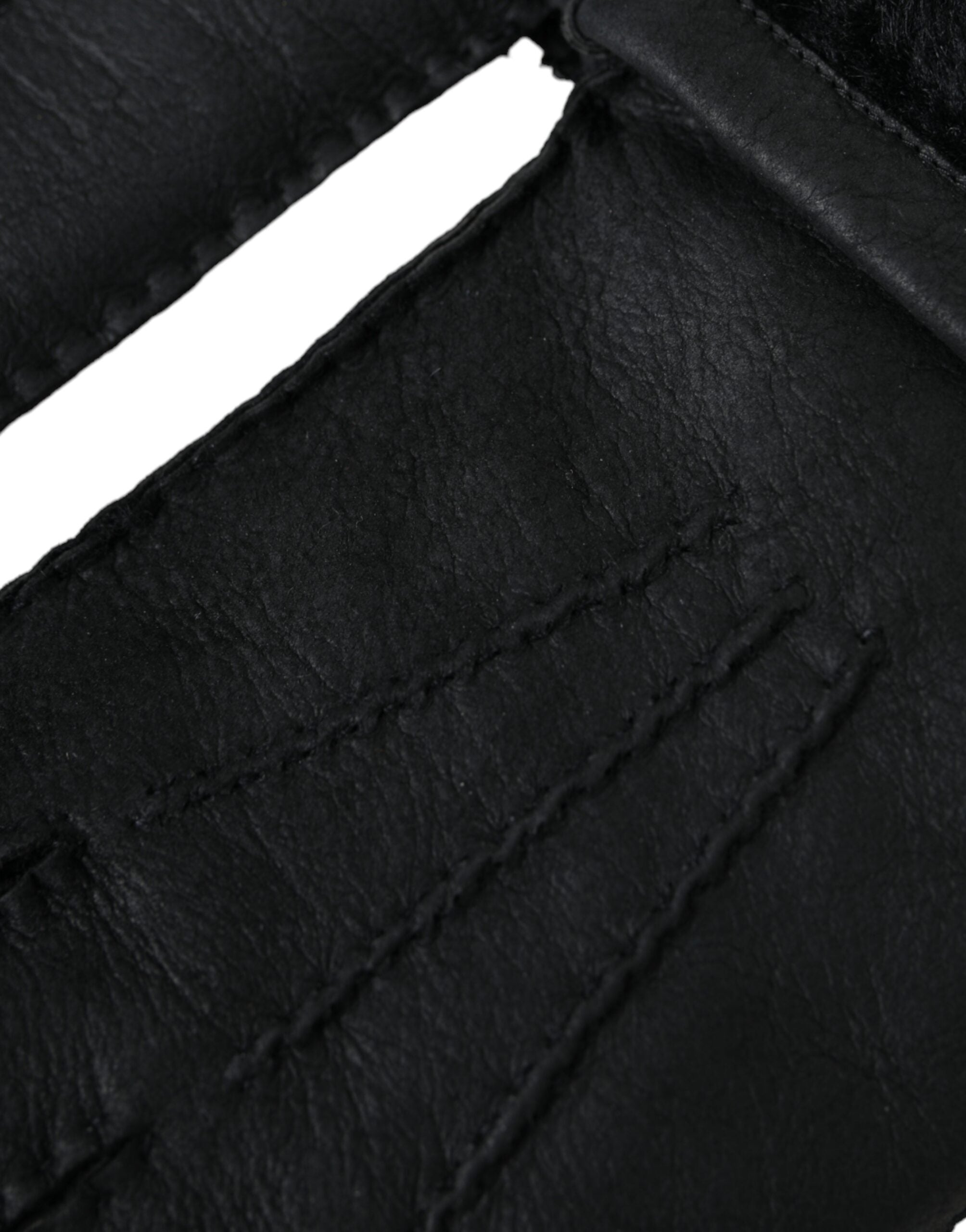 Black leather and fur short gloves by Dolce & Gabbana, showing close-up of stylish handwear with textured leather and soft fur accents.