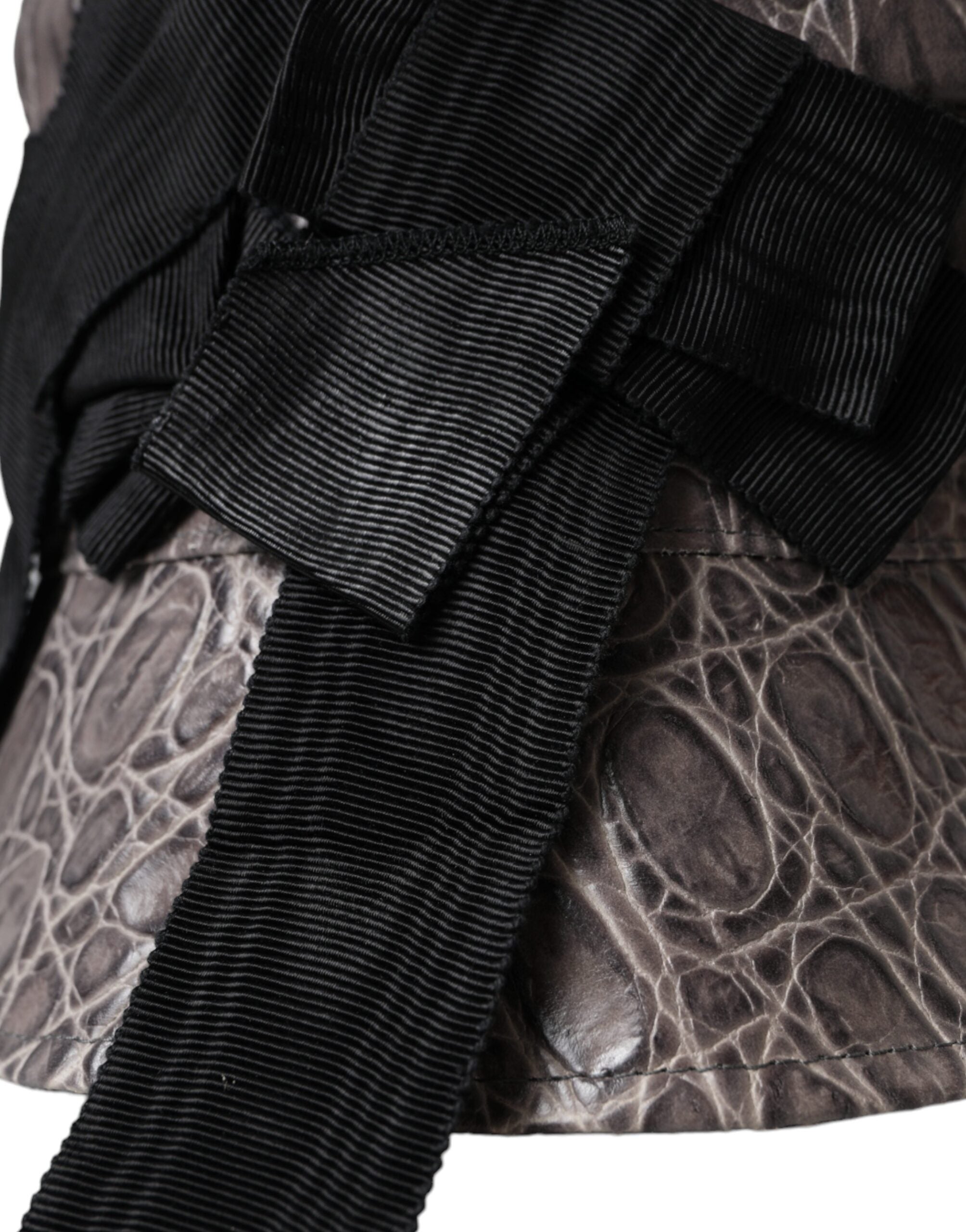 Black and gray patterned leather bucket hat by Dolce & Gabbana with stylish brim and textured design.