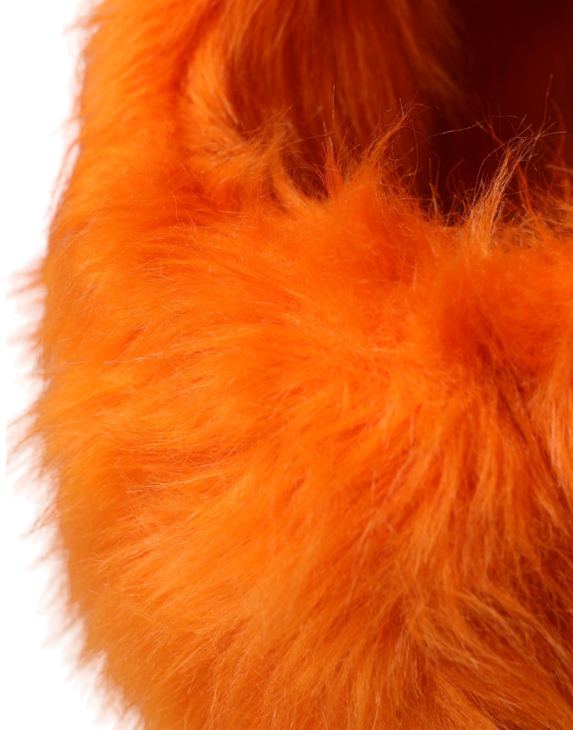 Orange faux fur Dolce & Gabbana head wrap hat with full head coverage and plush texture.