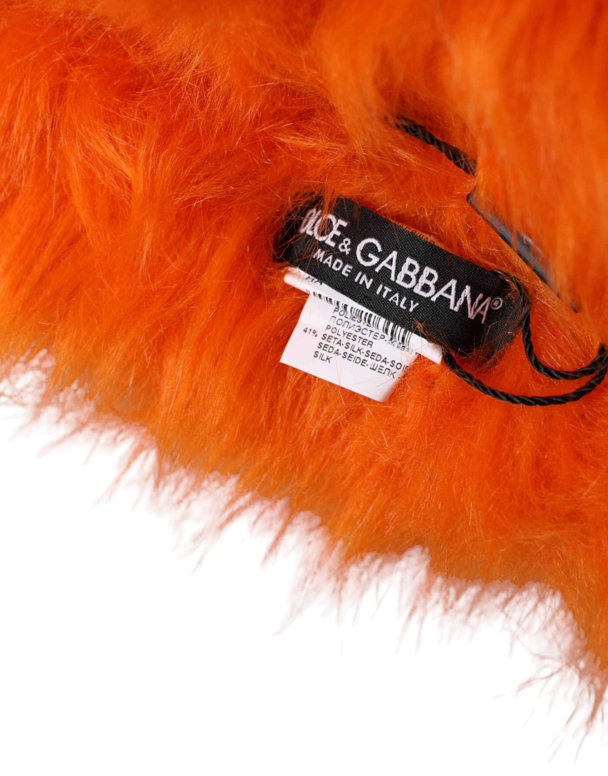 Orange faux fur whole head wrap hat by Dolce & Gabbana, featuring a plush, stylish furry head covering.