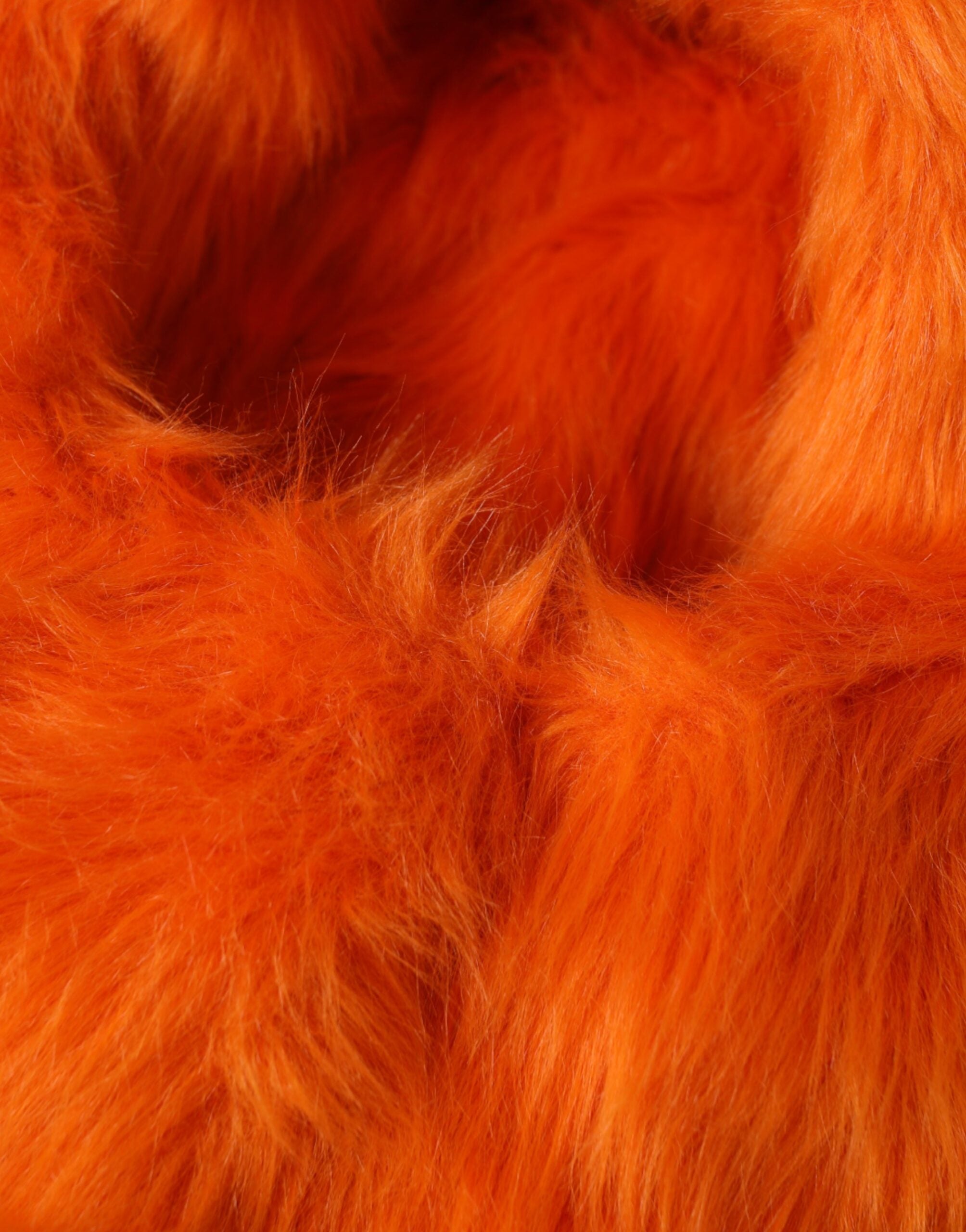Orange faux fur Dolce & Gabbana head wrap hat with full head coverage and plush texture, stylish and cozy accessory.