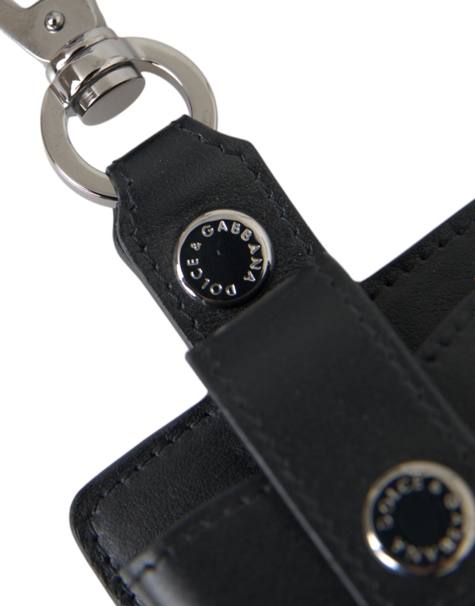 Black plain leather AirPods case by Dolce & Gabbana with silver metal accents, designed to protect and stylishly store AirPods.