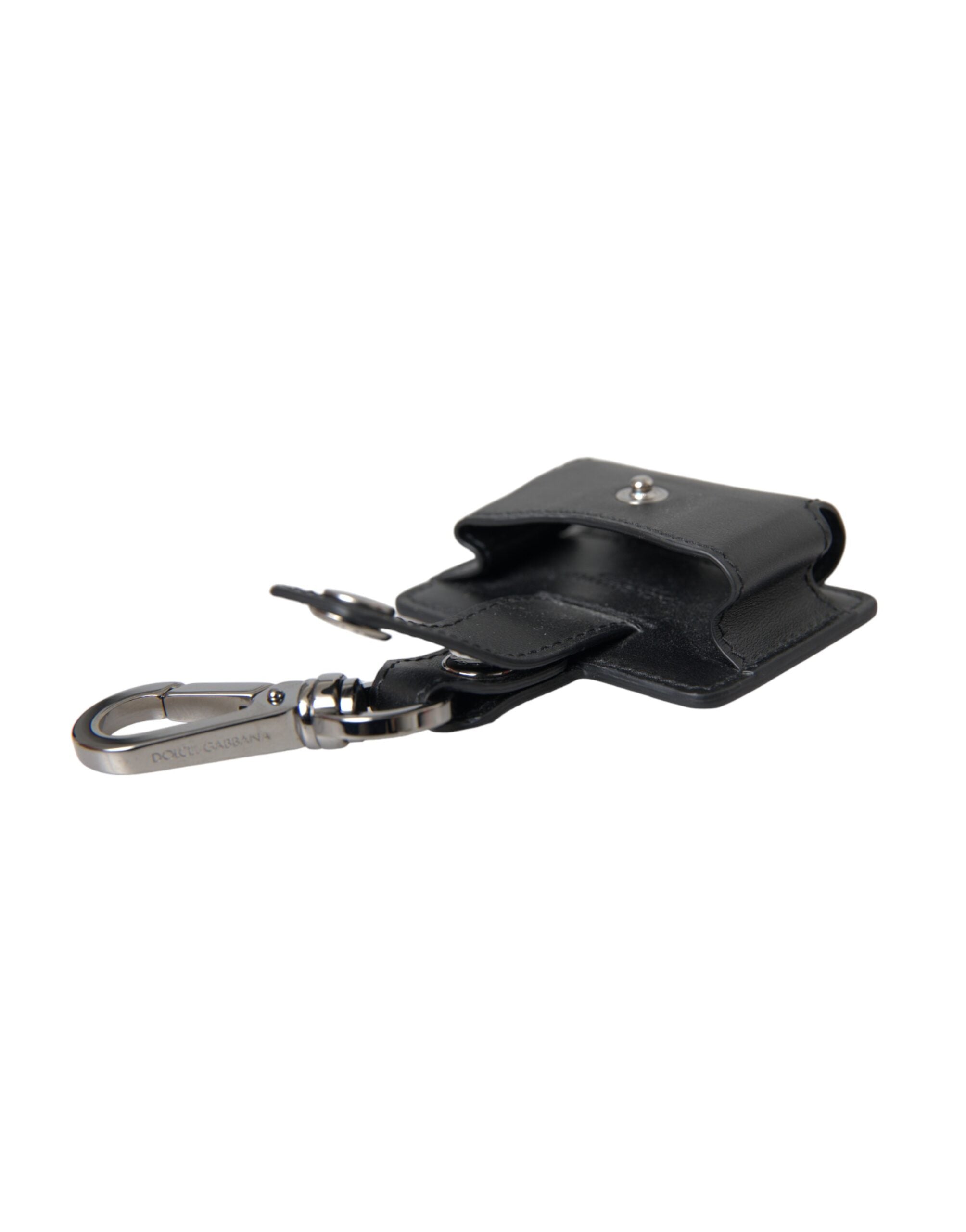 Black plain leather AirPods case with silver metal accents, designed by Dolce & Gabbana, showing the case open with AirPods inside.