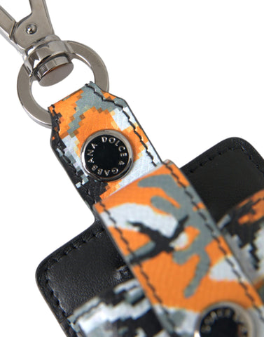 Multicolor camouflage print leather AirPods case by Dolce & Gabbana with metal accents and secure closure.