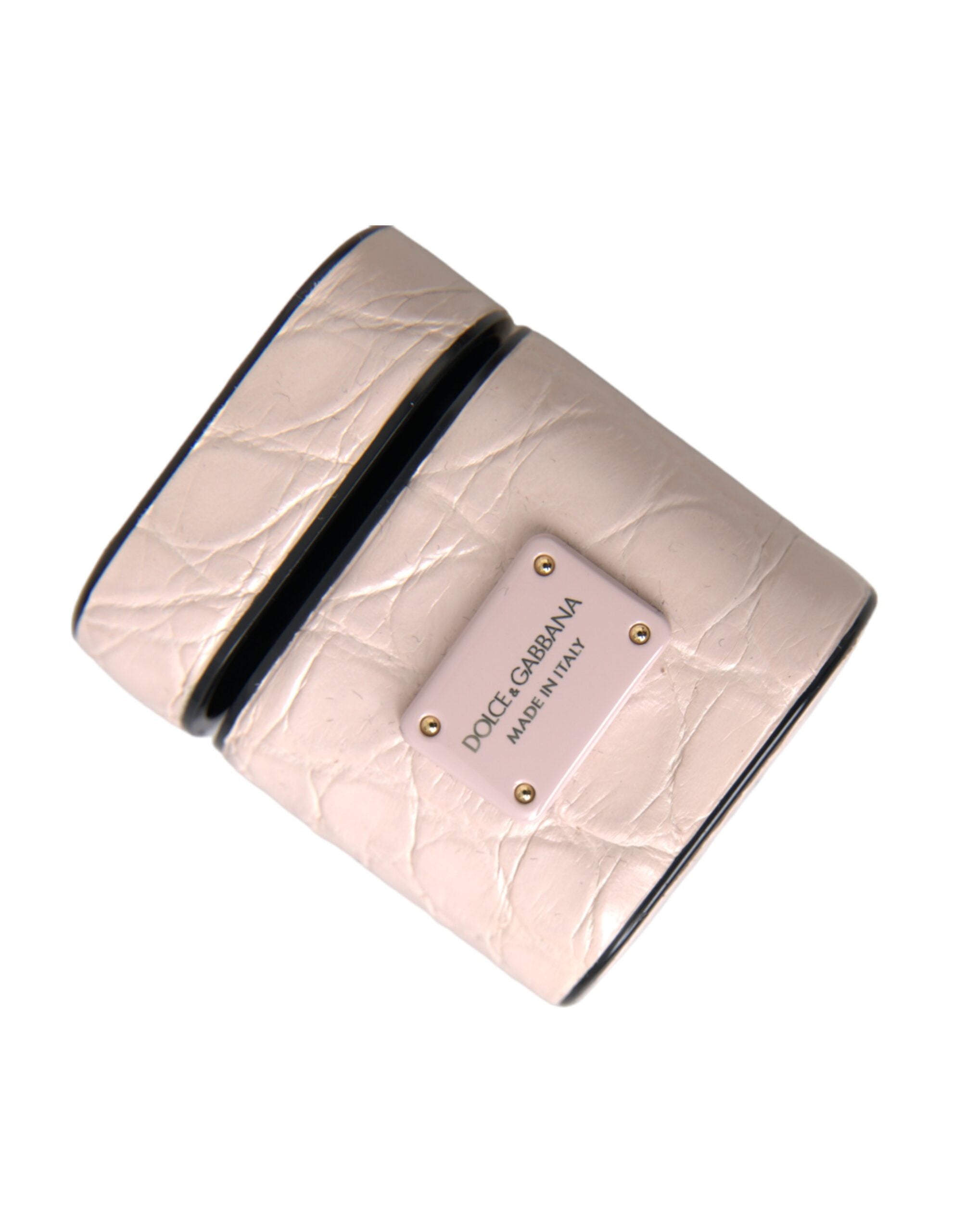 Light pink leather AirPods case with metal Dolce & Gabbana logo plaque, stylish protective accessory for wireless earbuds.