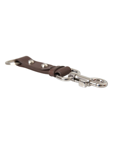 Brown plain leather keyring holder with silver brass keychain, designed by Dolce & Gabbana, featuring a sleek and minimalist style.