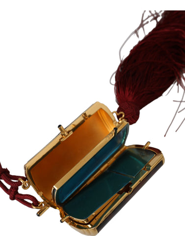 Brown leopard print mini mirror and tassel makeup holder bag by Dolce & Gabbana with a compact design and decorative accents.