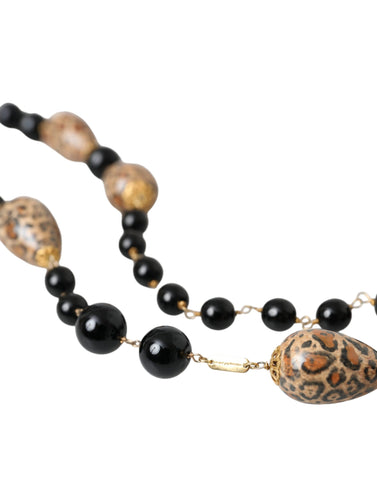 Gold-tone brass long necklace with black printed beads and chain, designed by Dolce & Gabbana, featuring a stylish, layered look.