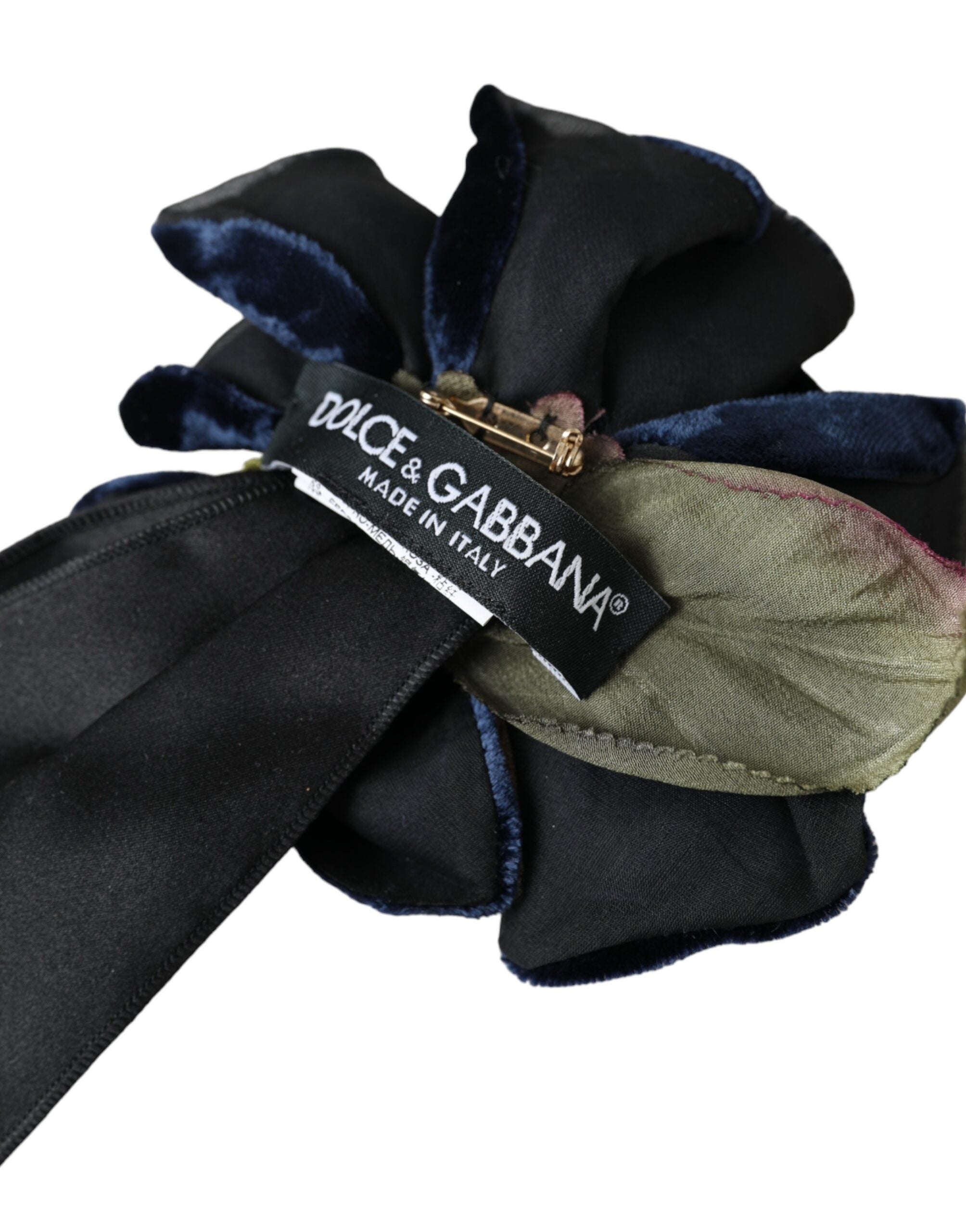 Black silk floral hair pin brooch with gold brass accents, designed by Dolce & Gabbana, featuring intricate floral detailing.