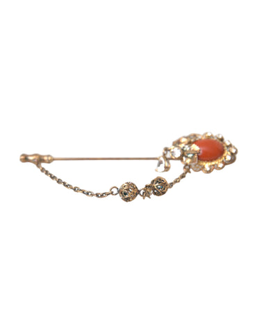 Gold brass and crystal chain with a 925 sterling silver pin brooch from Dolce & Gabbana, featuring intricate design details.