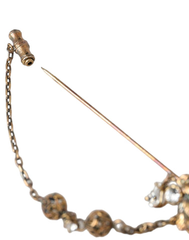 Gold brass crystal chain with a 925 sterling silver pin brooch, featuring intricate detailing and elegant design by Dolce & Gabbana.