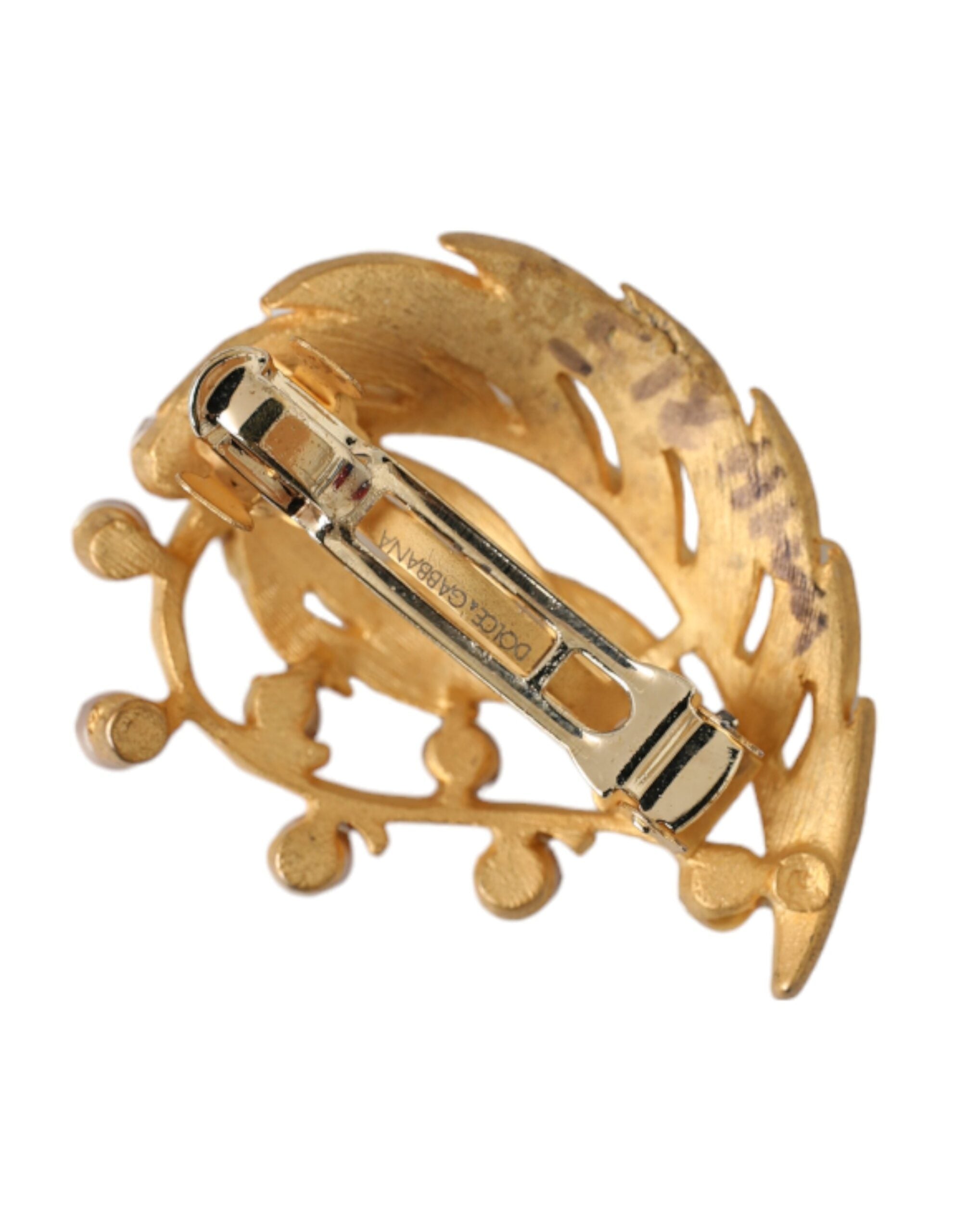Gold brass leaf-embellished jewelry brooch hair pin by Dolce & Gabbana, featuring intricate leaf design and elegant craftsmanship.