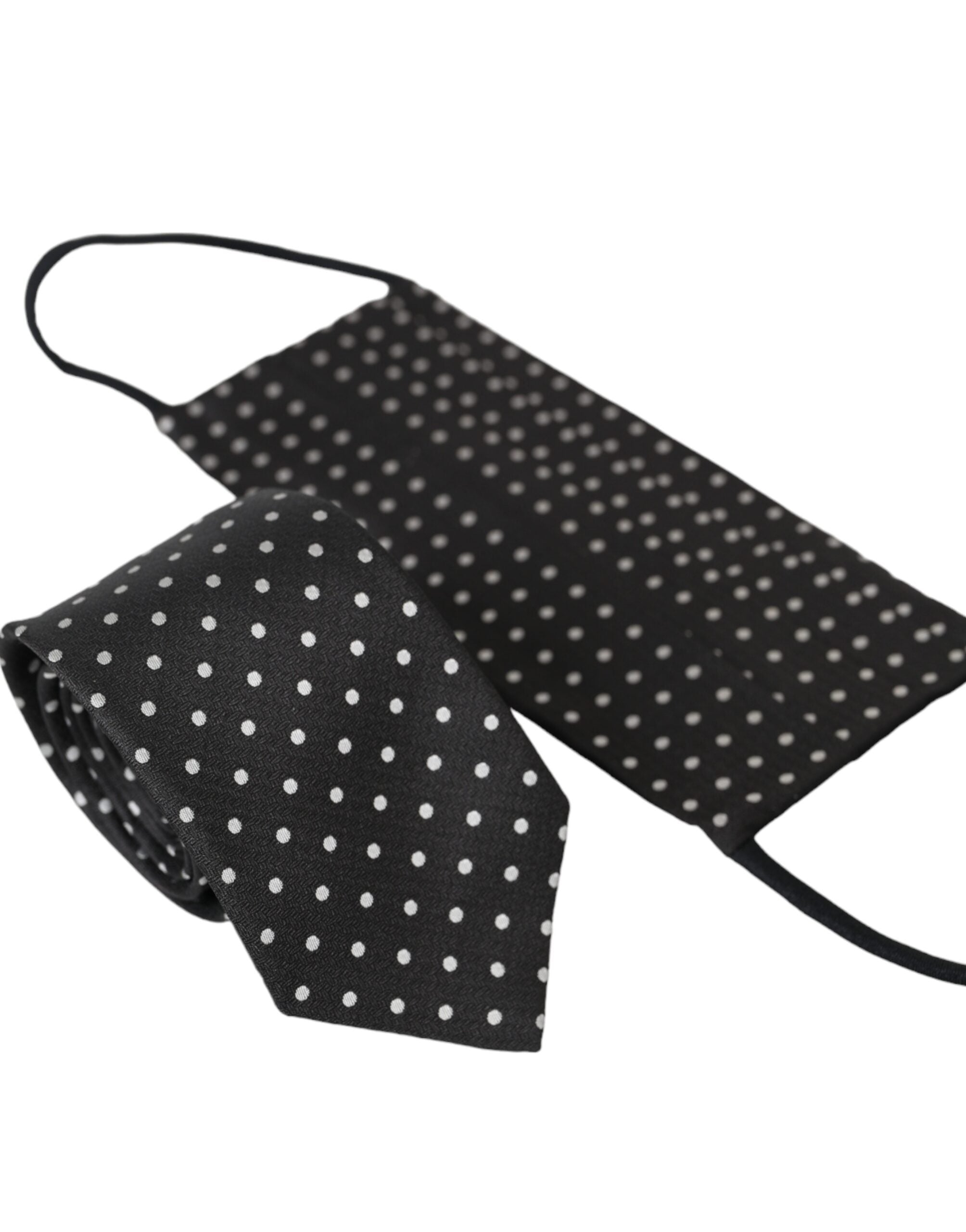 Black and white polka dot silk face mask with necktie design by Dolce & Gabbana, featuring a stylish and elegant pattern.