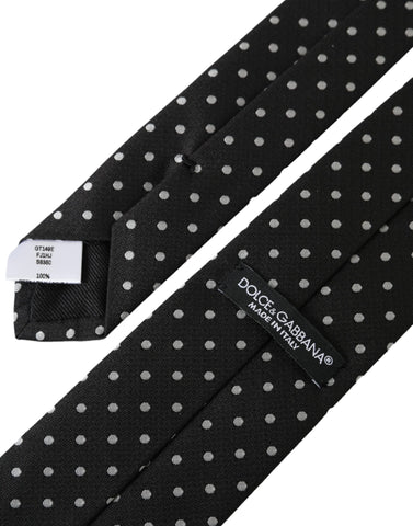 Black and white polka dot silk necktie face mask by Dolce & Gabbana with adjustable ear loops and smooth fabric.