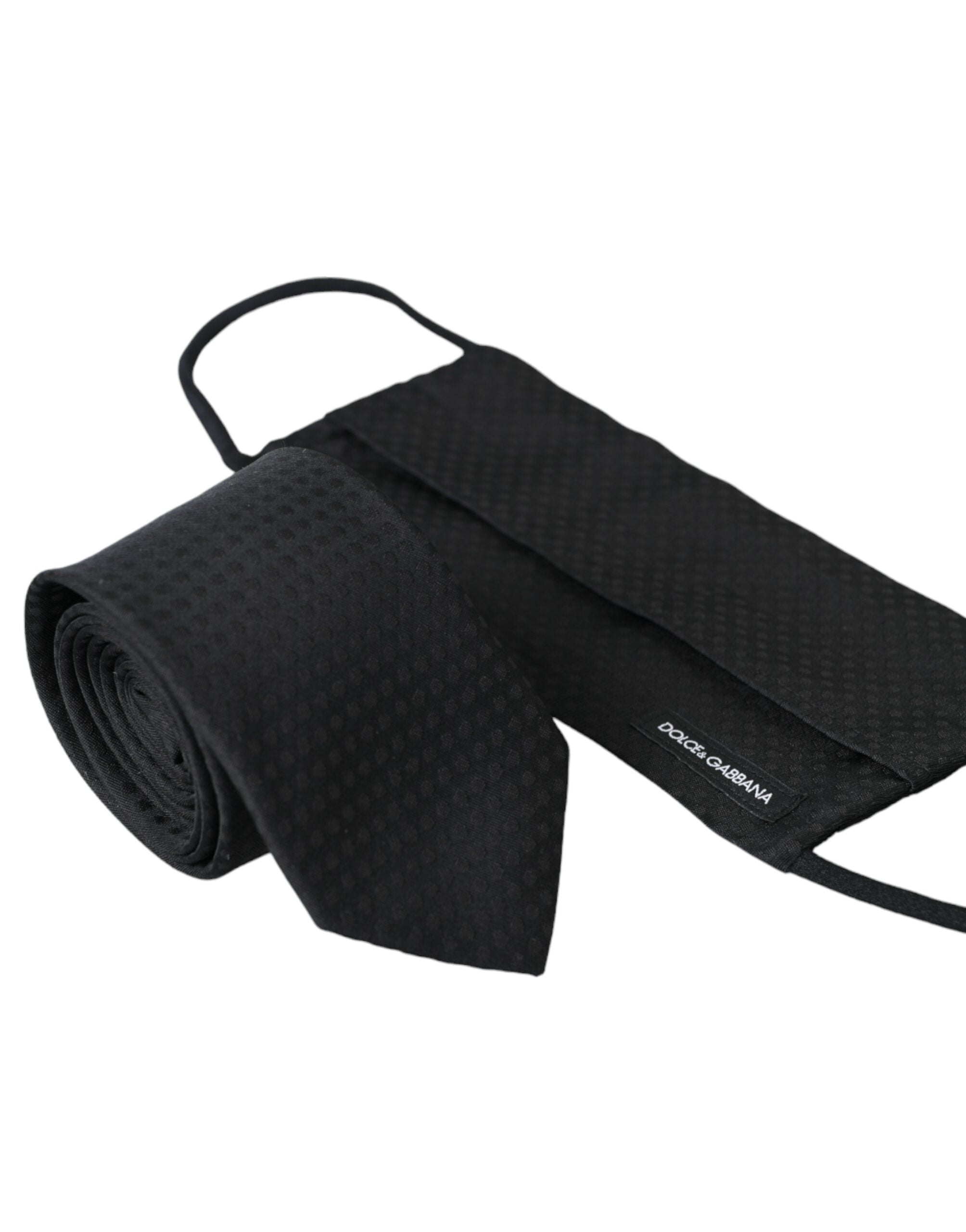 Black 100% silk adjustable necktie face mask by Dolce & Gabbana, featuring a smooth silk fabric and adjustable strap for comfortable fit.