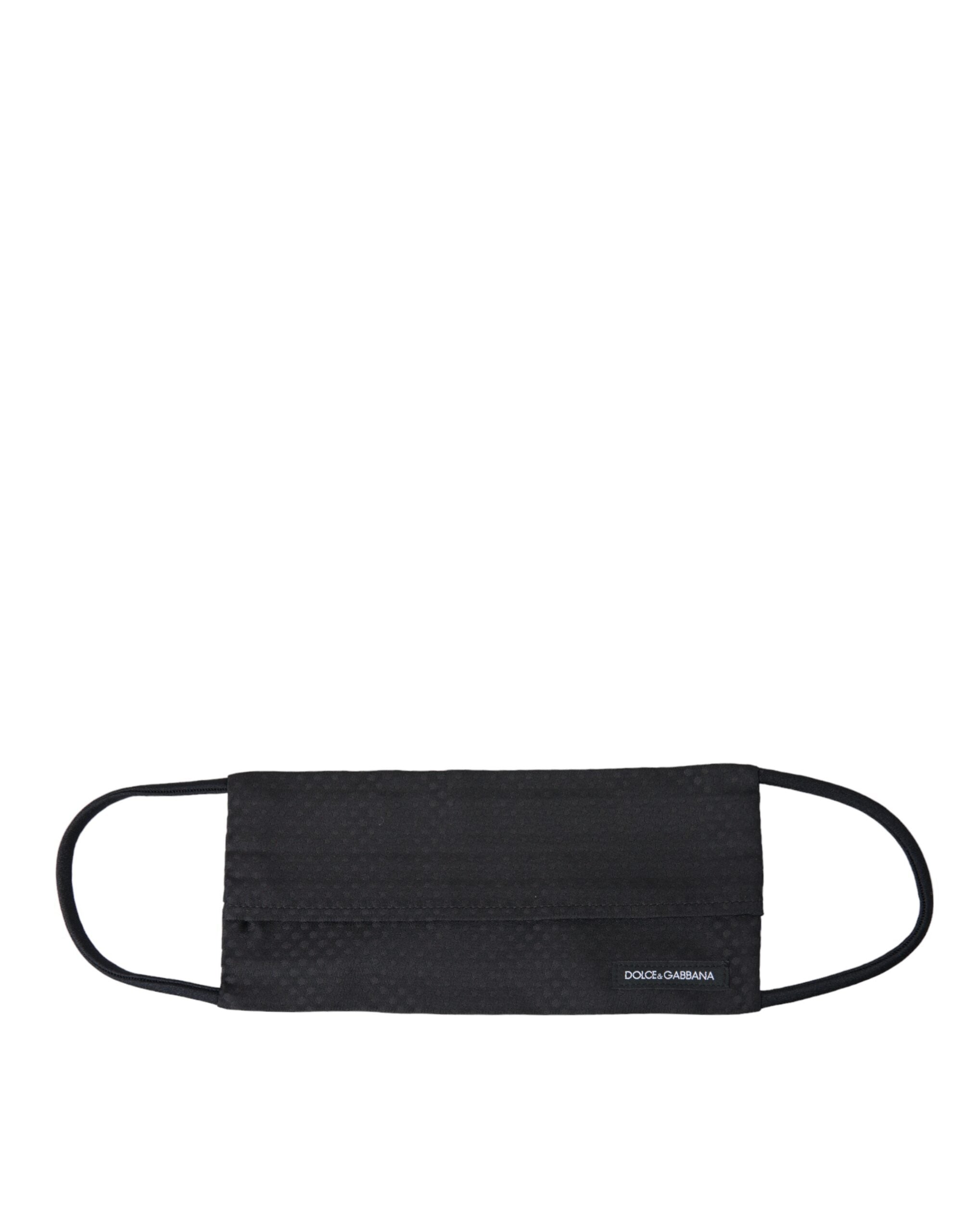 Black 100% silk adjustable necktie face mask by Dolce & Gabbana with sleek, smooth fabric and adjustable ear loops.