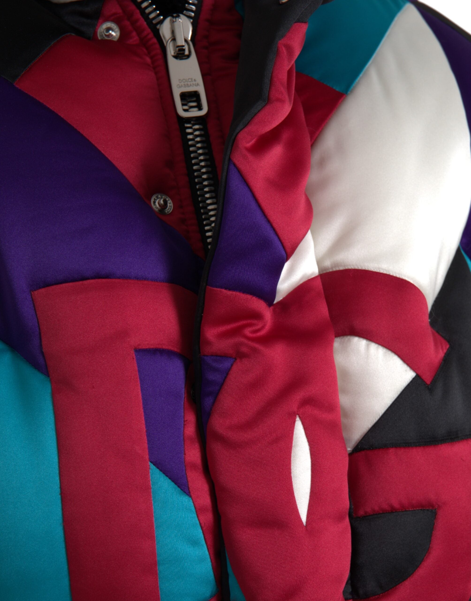 Multicolor logo Dolce & Gabbana puffer windbreaker jacket with vibrant branding and quilted design.