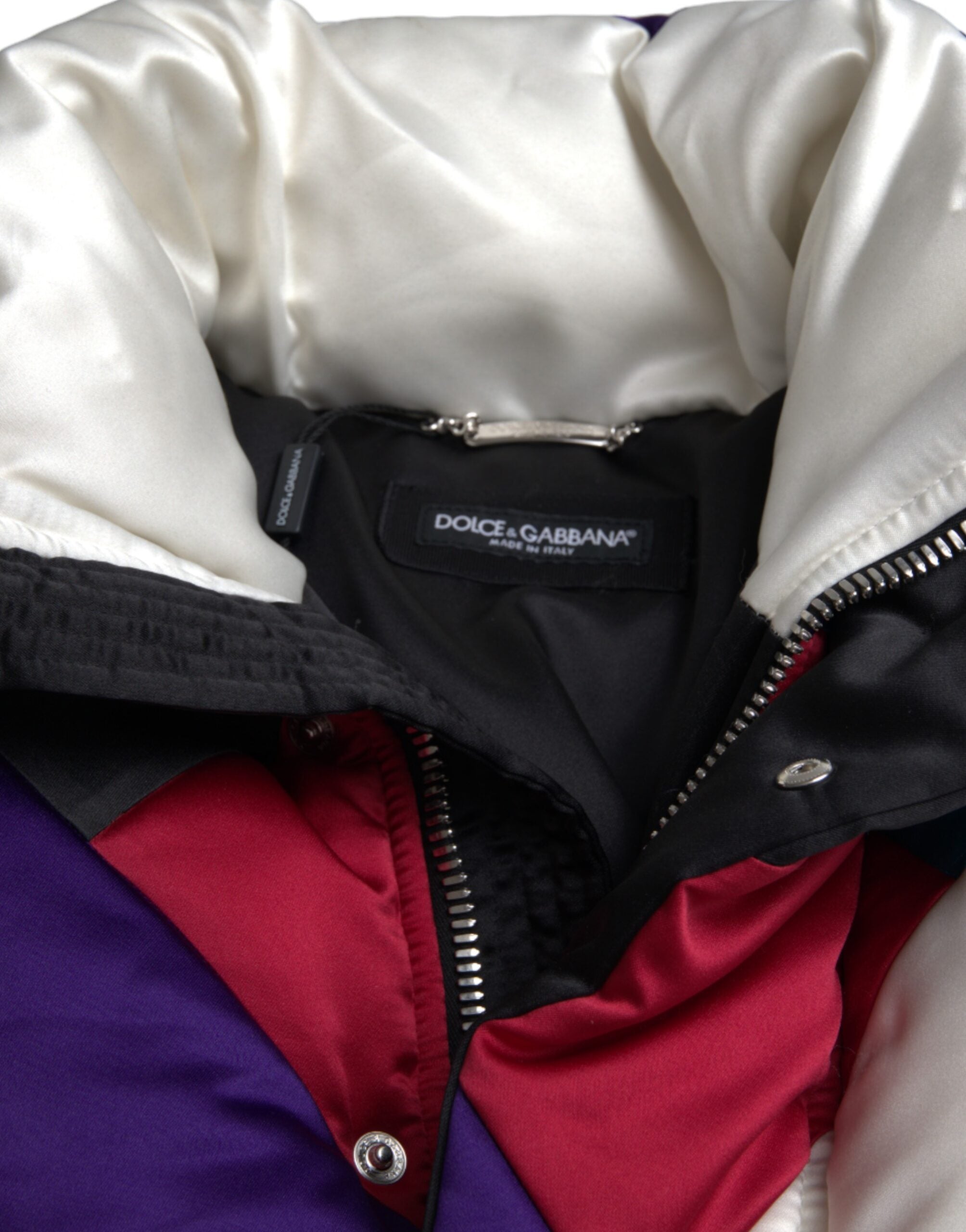 Multicolor logo Dolce & Gabbana puffer windbreaker jacket with bold branding and vibrant color block design.