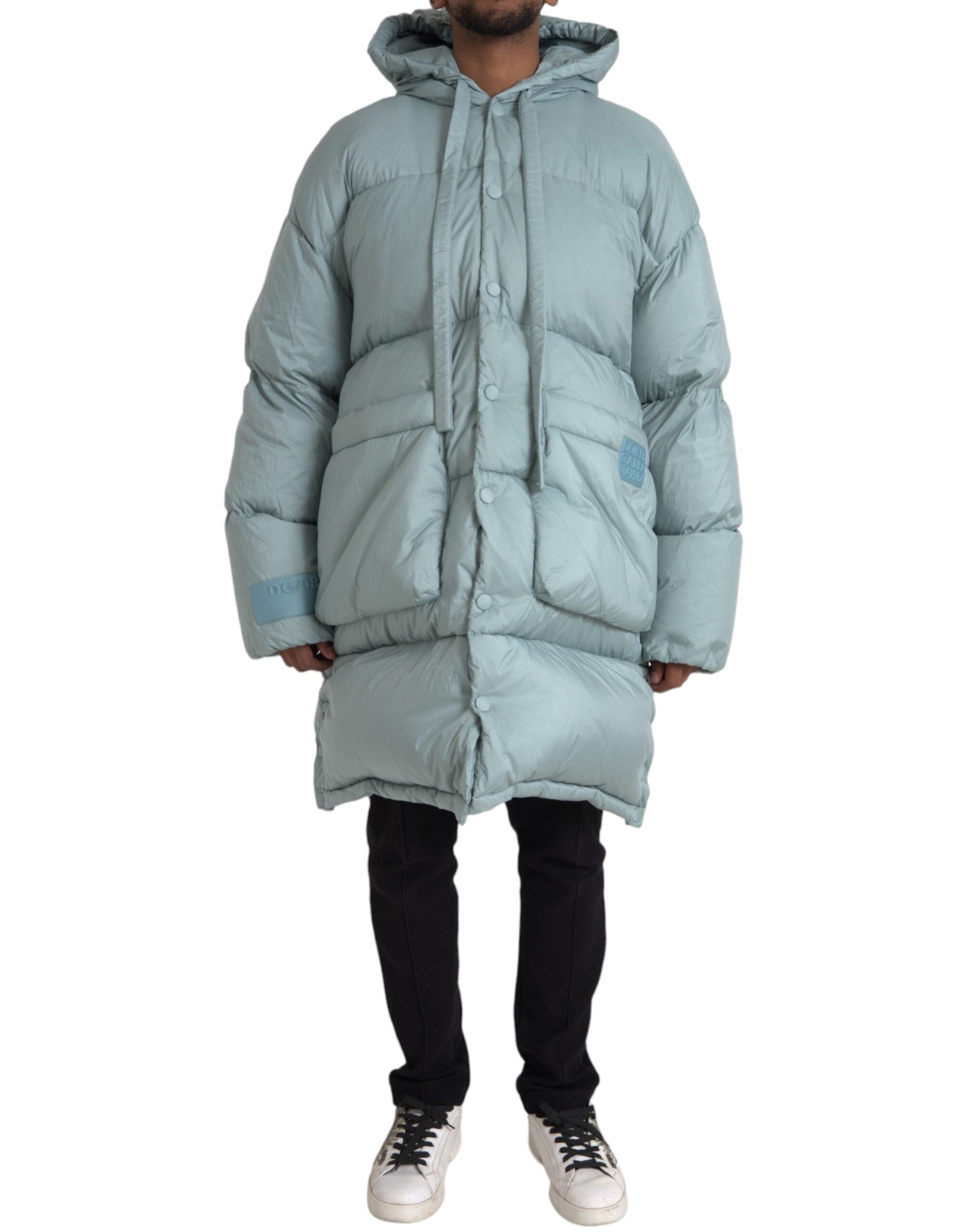 Light blue quilted hooded puffer jacket for men by Dolce & Gabbana, featuring a padded design and front zipper closure.