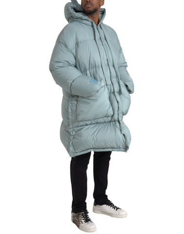 Light blue quilted puffer hooded jacket for men by Dolce & Gabbana, shown with a front view highlighting the quilted design and hood.