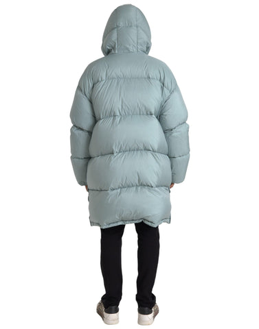 Light blue quilted hooded puffer jacket for men by Dolce & Gabbana, showcasing its stylish quilted design and hood detail.