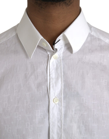 White cotton long sleeve dress by Dolce & Gabbana with gold accents and a classic, elegant fit.