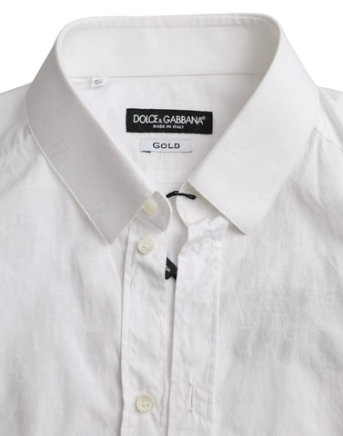 White cotton long sleeve dress by Dolce & Gabbana featuring a gold shirt detail and elegant, feminine design.