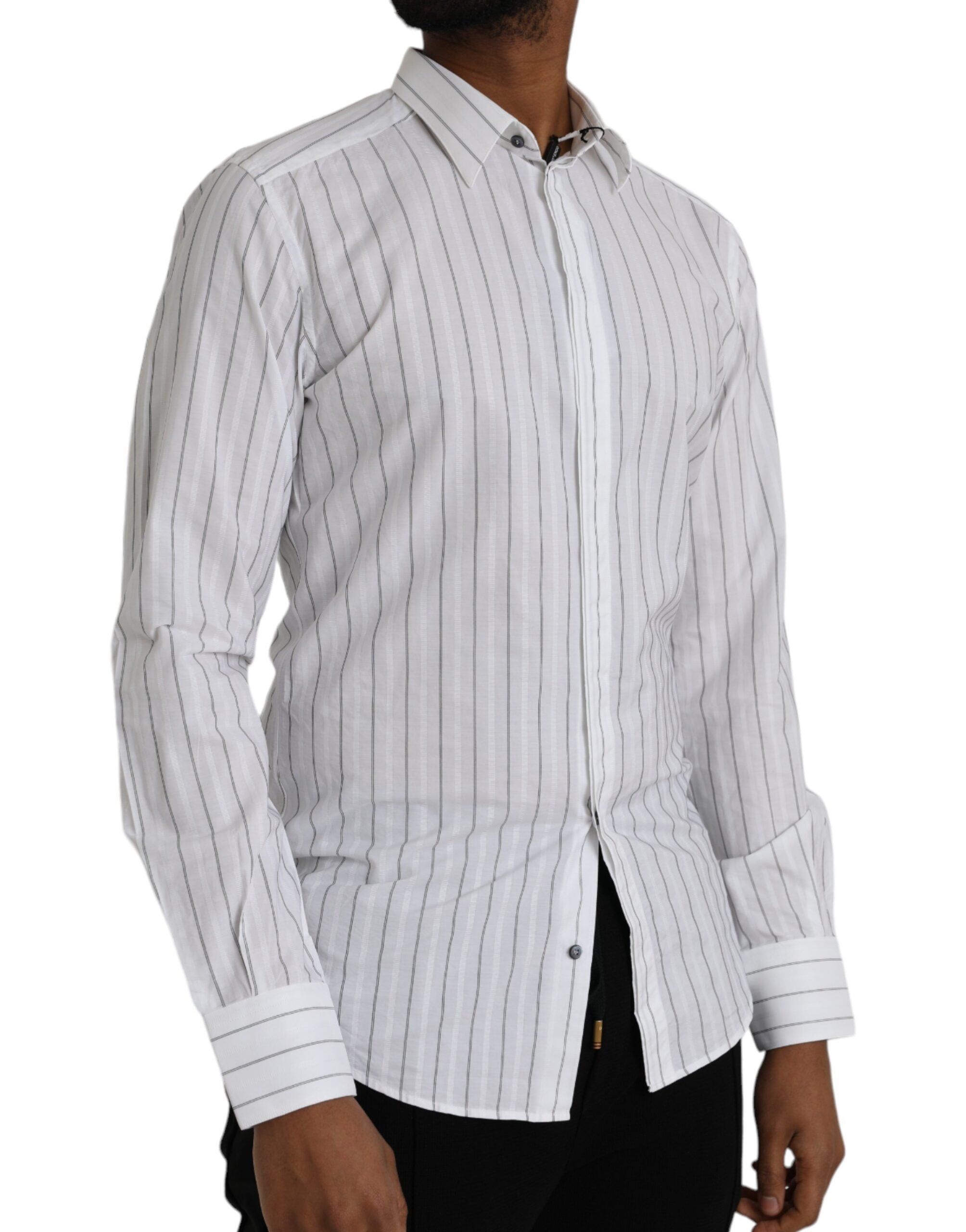 Black and white striped formal dress by Dolce & Gabbana featuring a gold shirt accent, shown on a model.