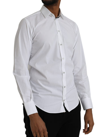 White cotton long sleeve dress by Dolce & Gabbana, featuring a classic, elegant design with a fitted silhouette.