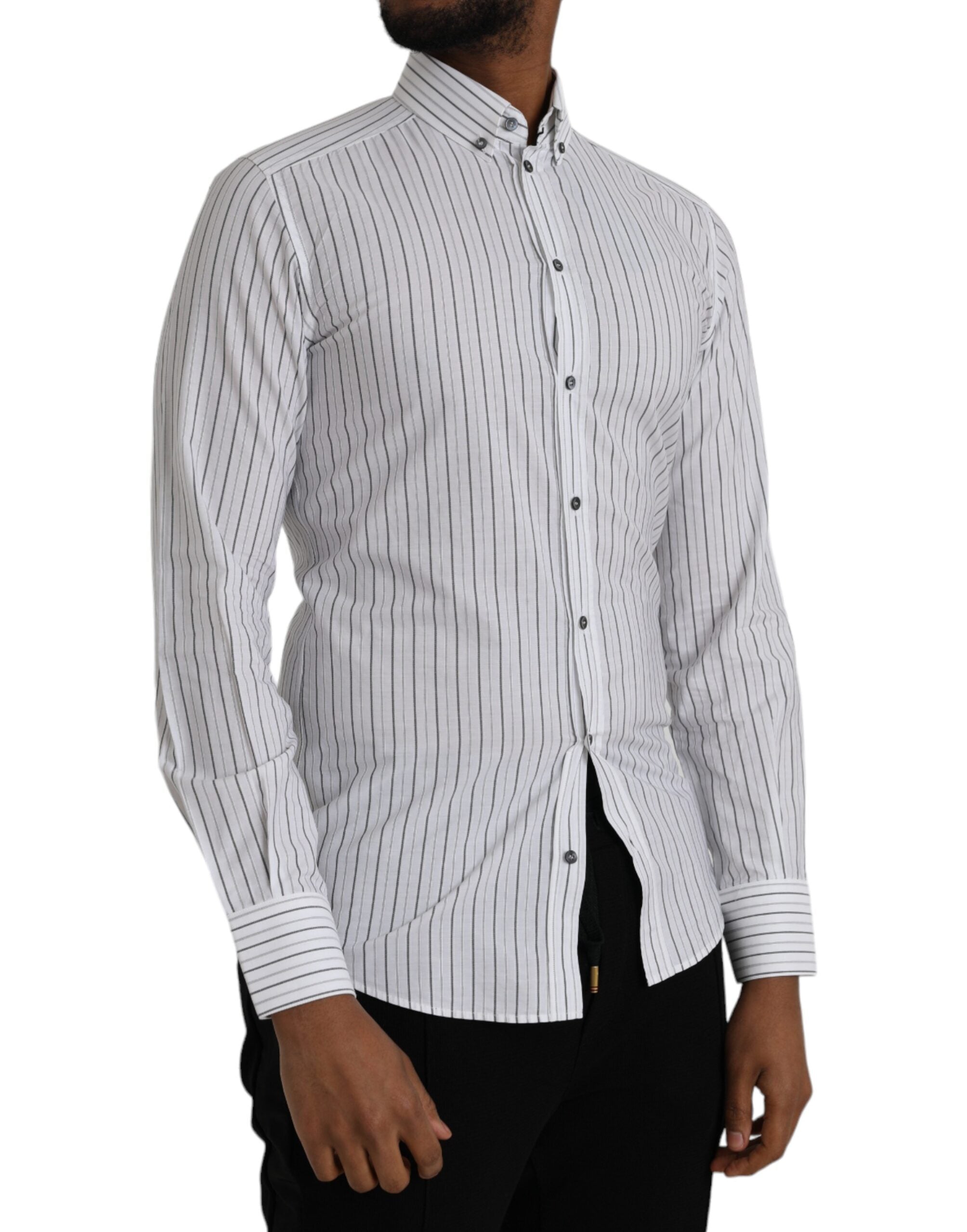 Black and white striped formal dress with gold accents from Dolce & Gabbana, featuring a fitted design and elegant style.