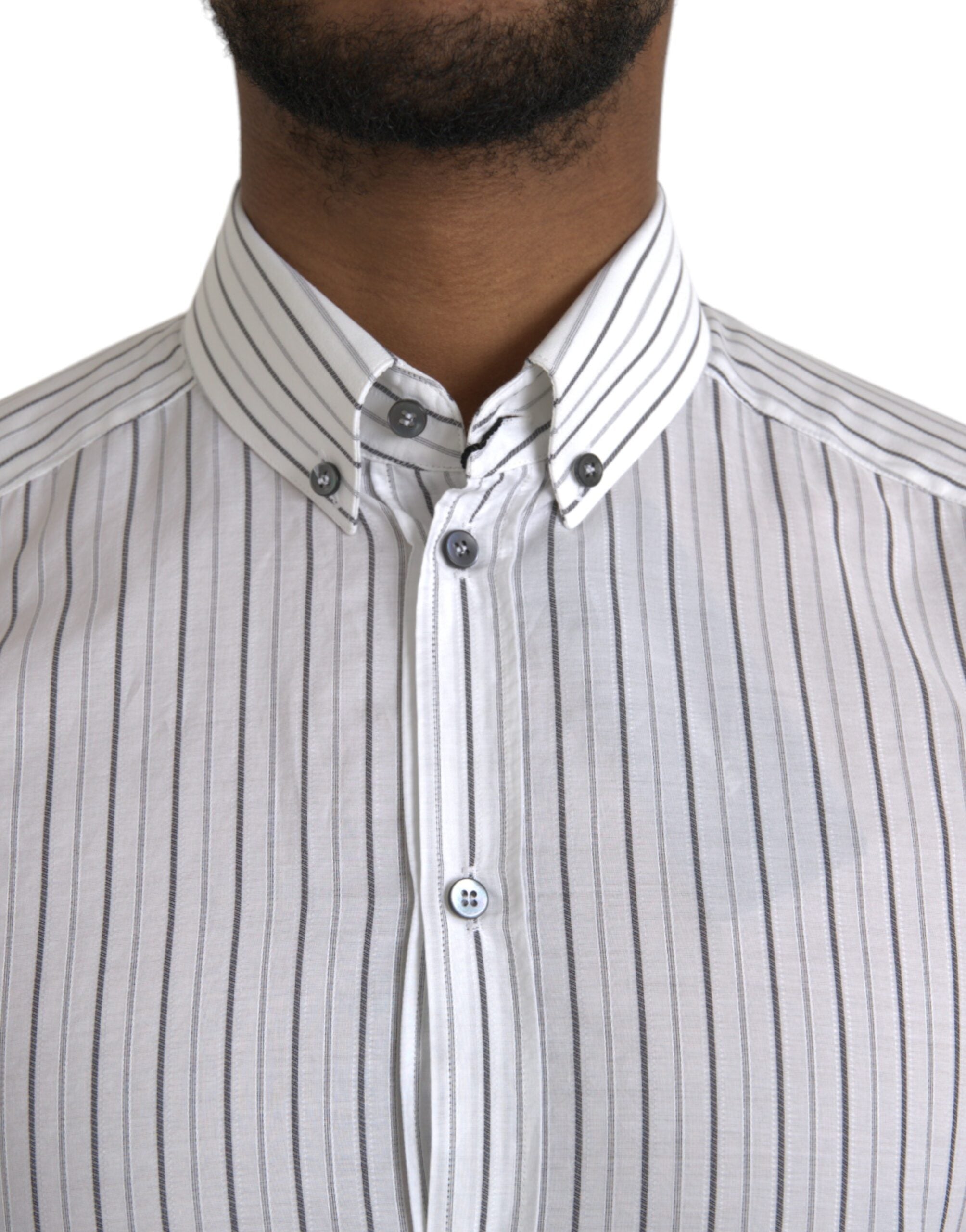 Black and white striped formal dress with gold accents by Dolce & Gabbana, featuring elegant design and tailored fit.