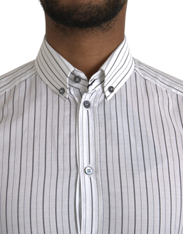 Black and white striped formal dress with gold accents by Dolce & Gabbana, featuring elegant design and tailored fit.