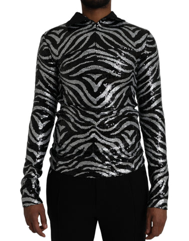 Black silver sequined polyester sweater by Dolce & Gabbana showing a close-up of sparkling sequined fabric and sweater neckline.