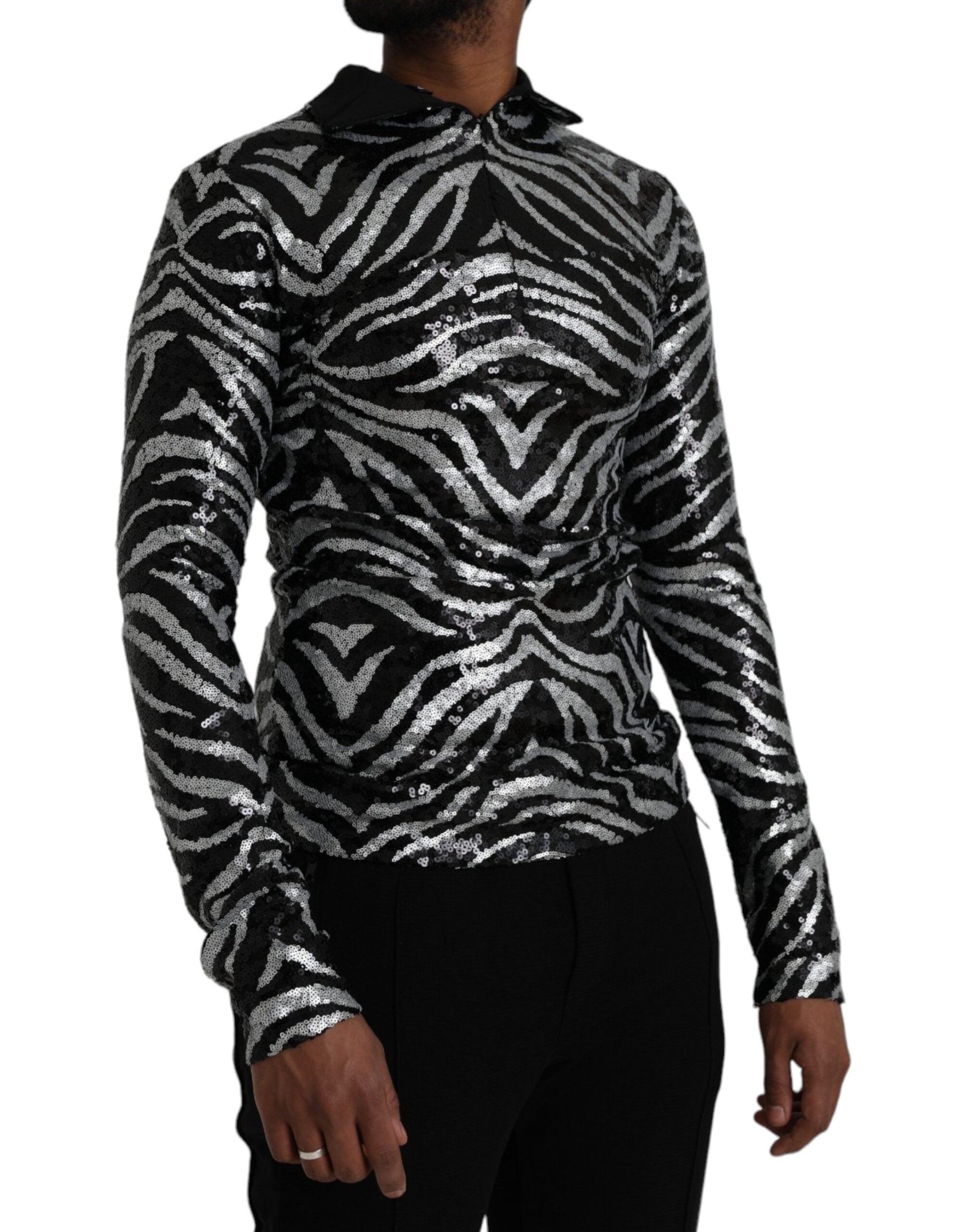Black and silver sequined polyester sweater by Dolce & Gabbana with a shimmering, fitted design and long sleeves.