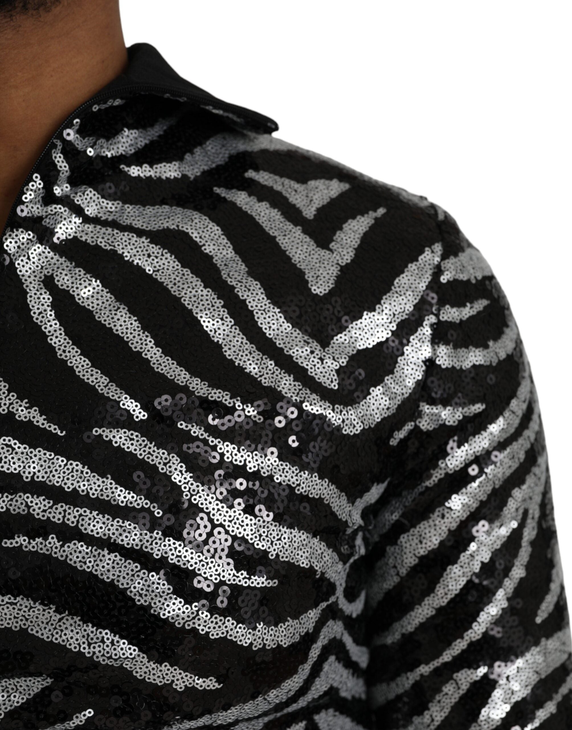 Black silver sequined polyester sweater by Dolce & Gabbana, featuring a sparkling, stylish design with long sleeves and a crew neckline.