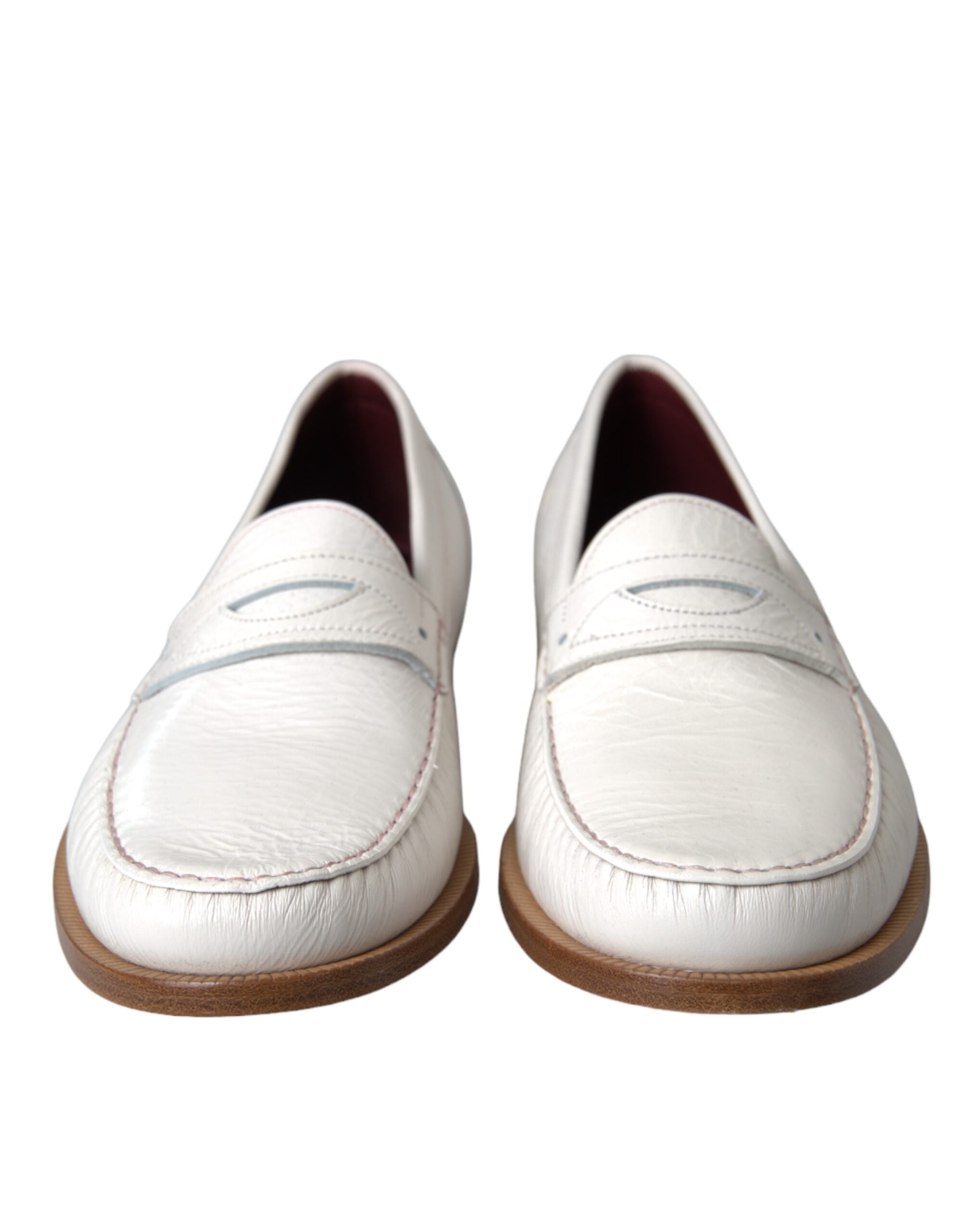 White leather slip-on moccasin loafers by Dolce & Gabbana, featuring sleek design and smooth finish.