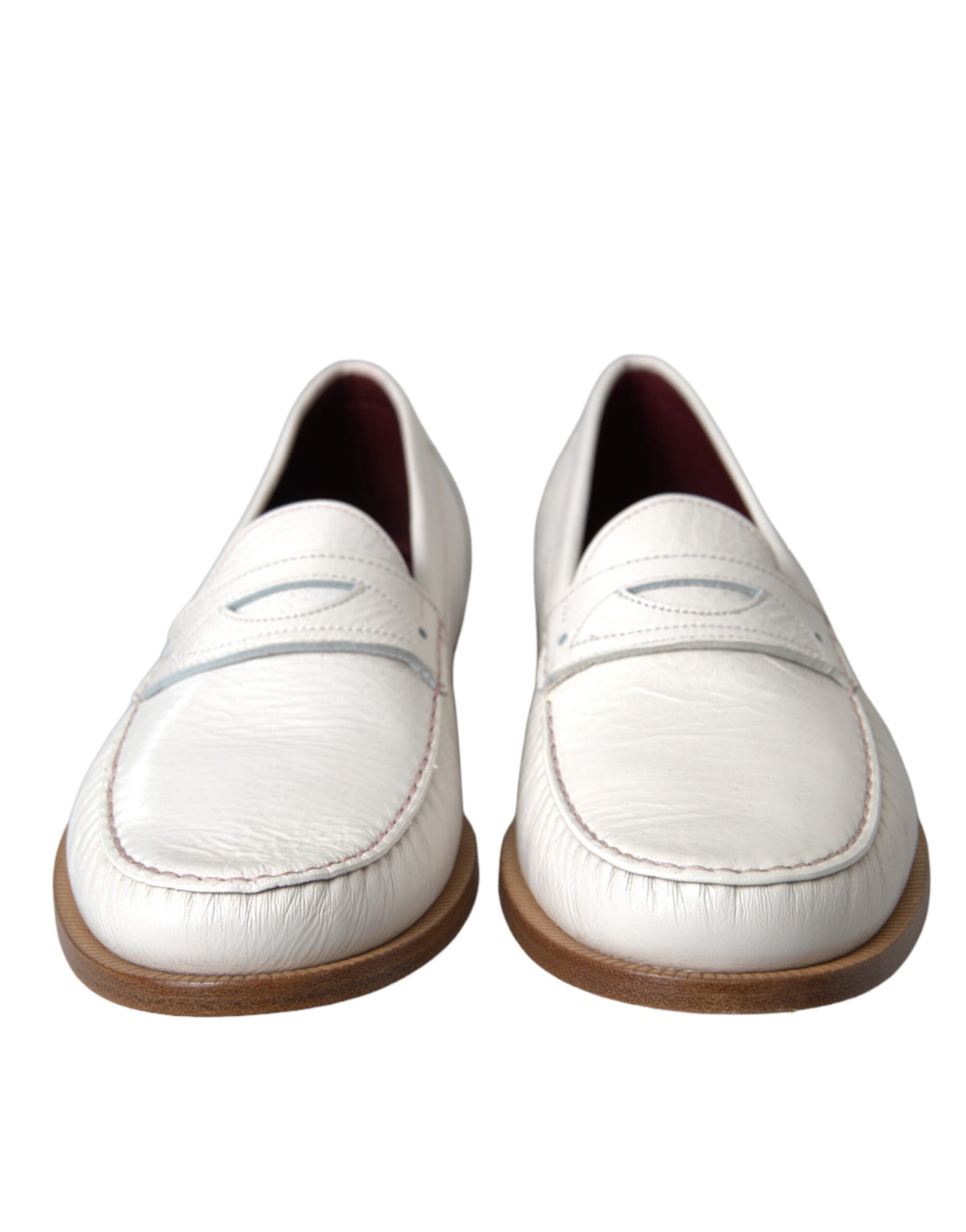 White leather slip-on moccasin loafers by Dolce & Gabbana, featuring sleek design and smooth finish.