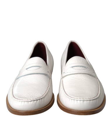 White leather slip-on moccasin loafers by Dolce & Gabbana, featuring sleek design and smooth finish.