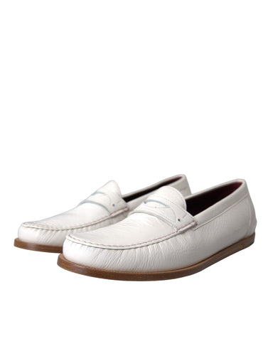 White leather slip-on moccasin loafers by Dolce & Gabbana, featuring a sleek and classic design with seamless stitching.