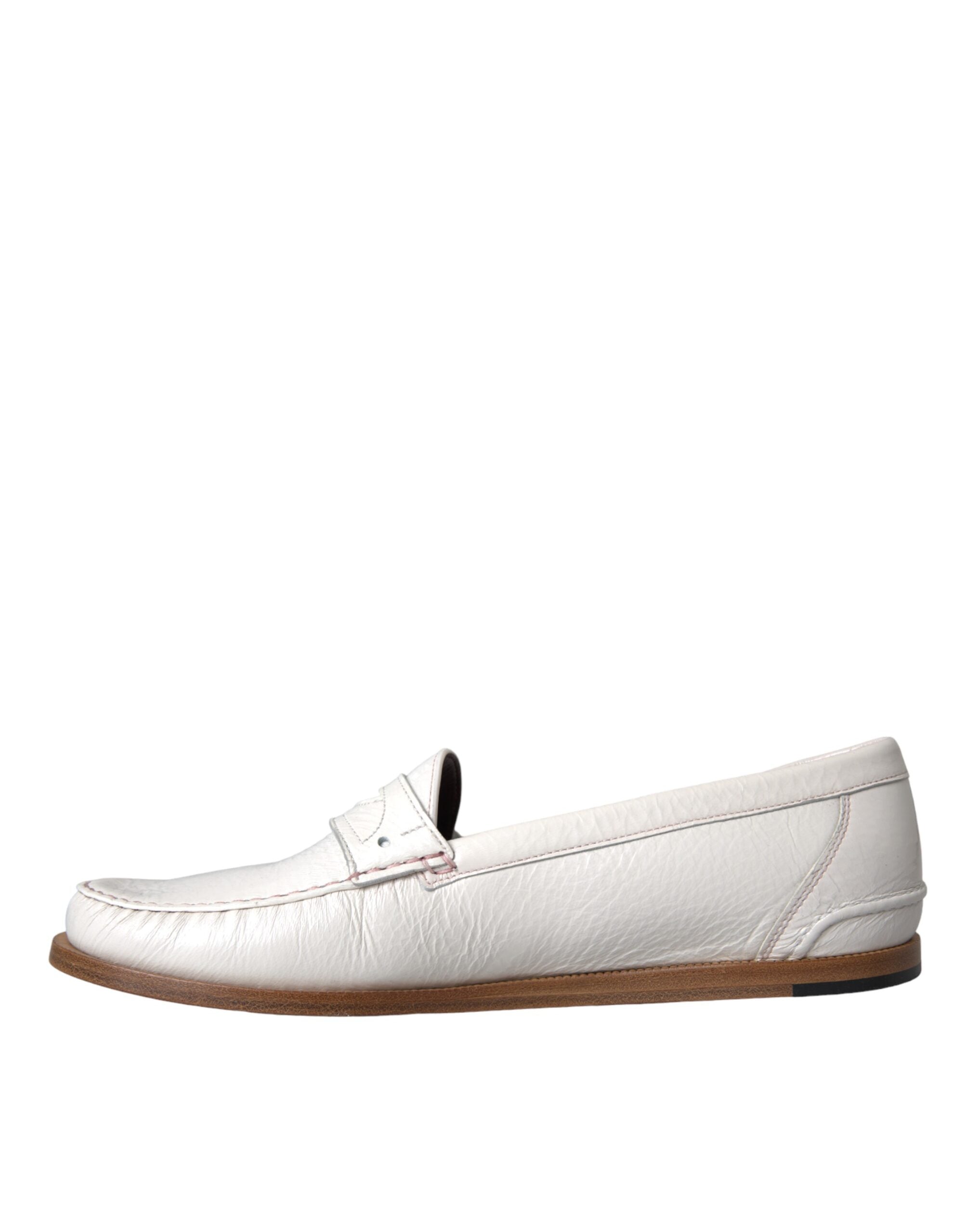White leather slip-on moccasin loafers by Dolce & Gabbana, featuring smooth leather and classic loafer style.