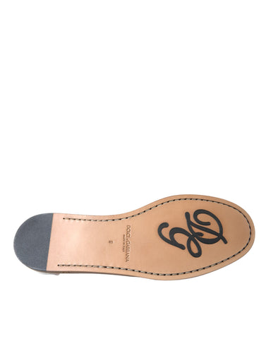 White leather slip-on mocassin loafers by Dolce & Gabbana, featuring a sleek design and classic almond toe silhouette.