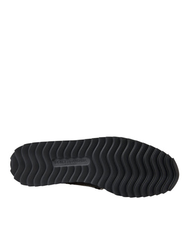 Black woven buffalo leather men's loafers by Dolce & Gabbana with sleek design and classic slip-on style.